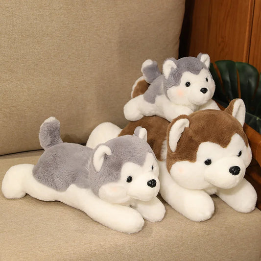 a group of teddy bears sitting on top of a couch 